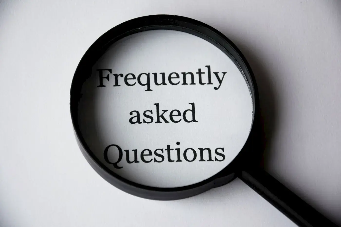 Illustration of a FAQ page with question marks and answers